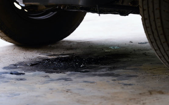 Black Oil Stains on the Parking Spot, Mostly Engine Oil Leaks - Orlando - 1